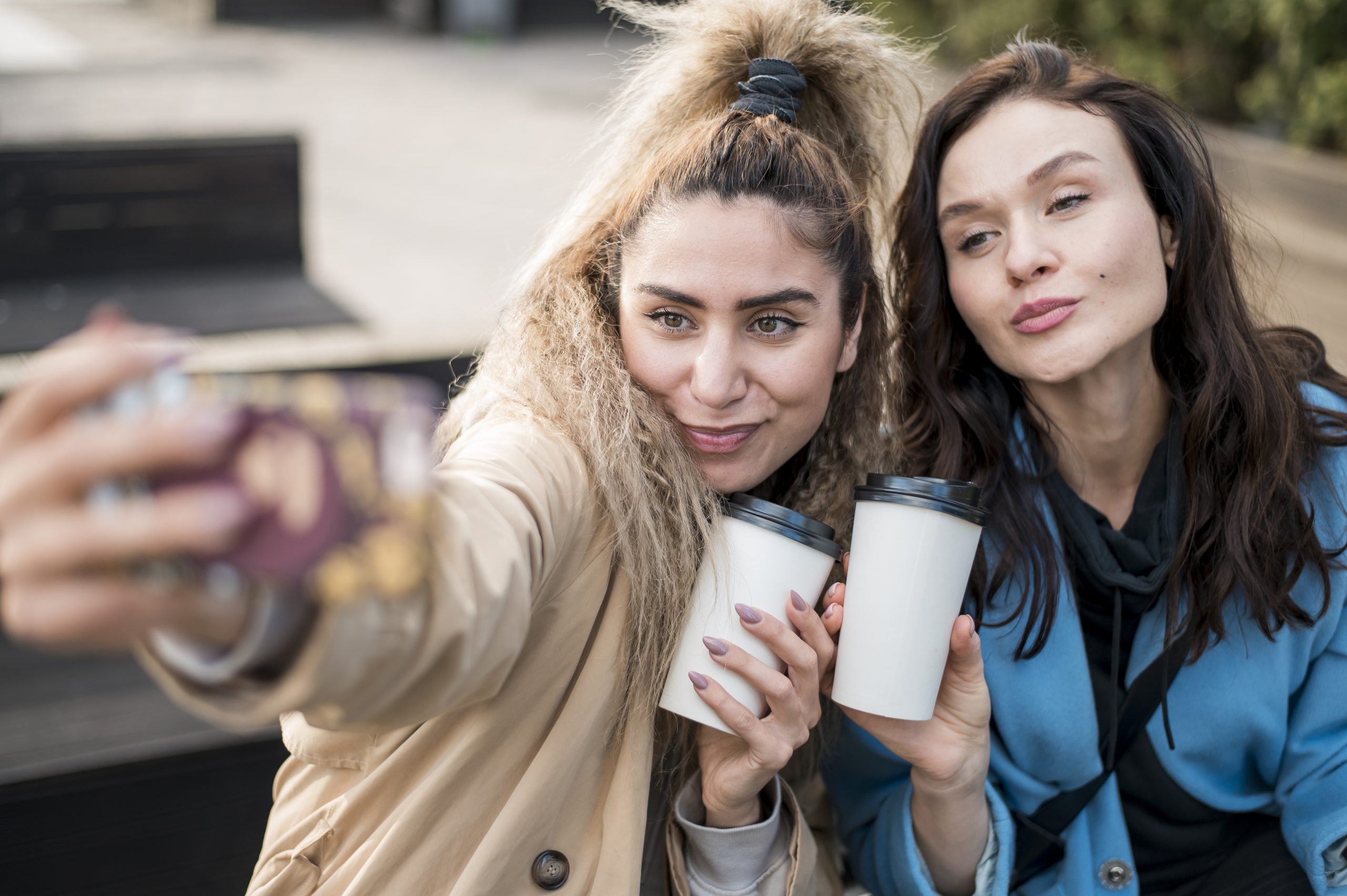 stylish-teenagers-taking-selfie-outdoors